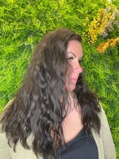 Image shows hair with hair extensions to add thickness and volume to the hair